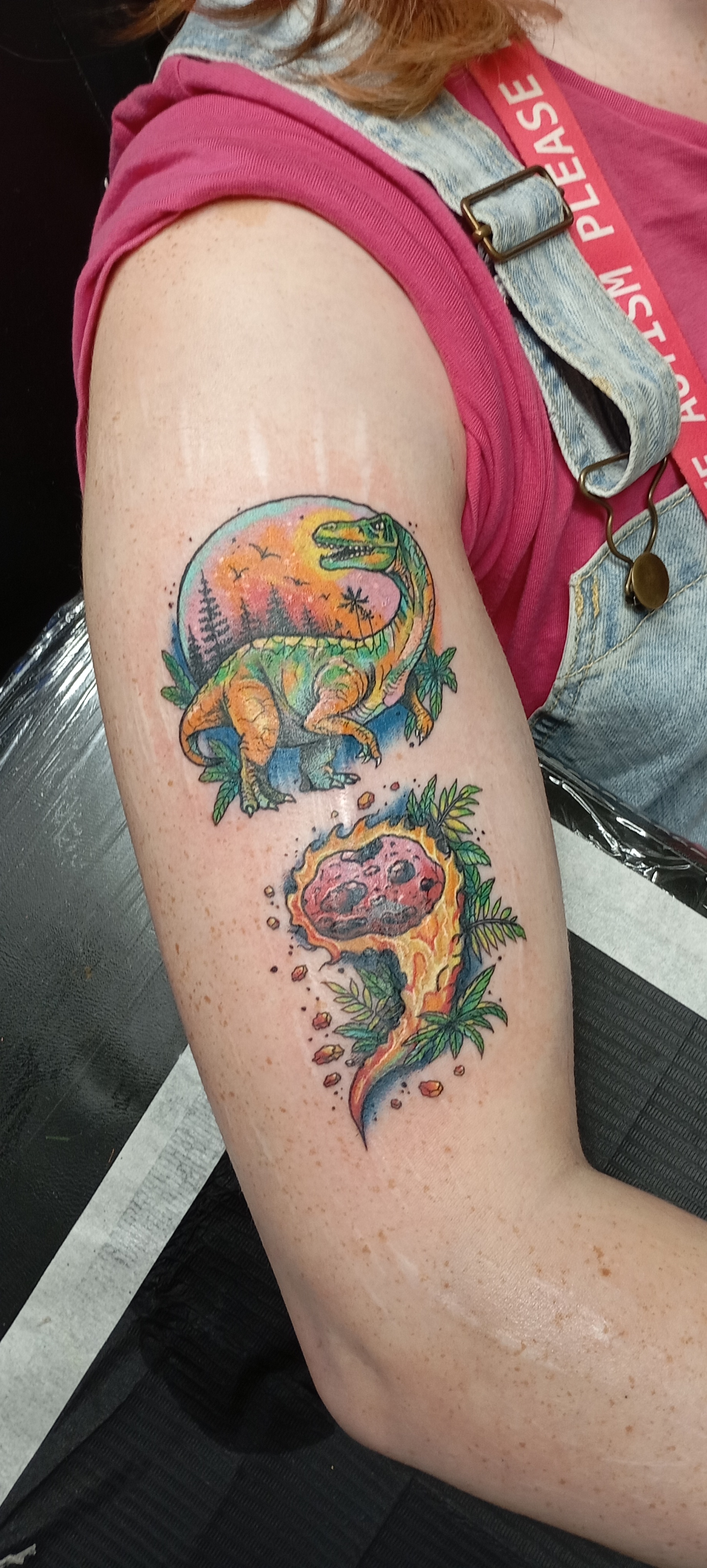 Brielle Labingi's new tattoo is on her arm depicting in colour a semi colon design of a comet and a dinosaur symbolic of an end not being a full stop.
